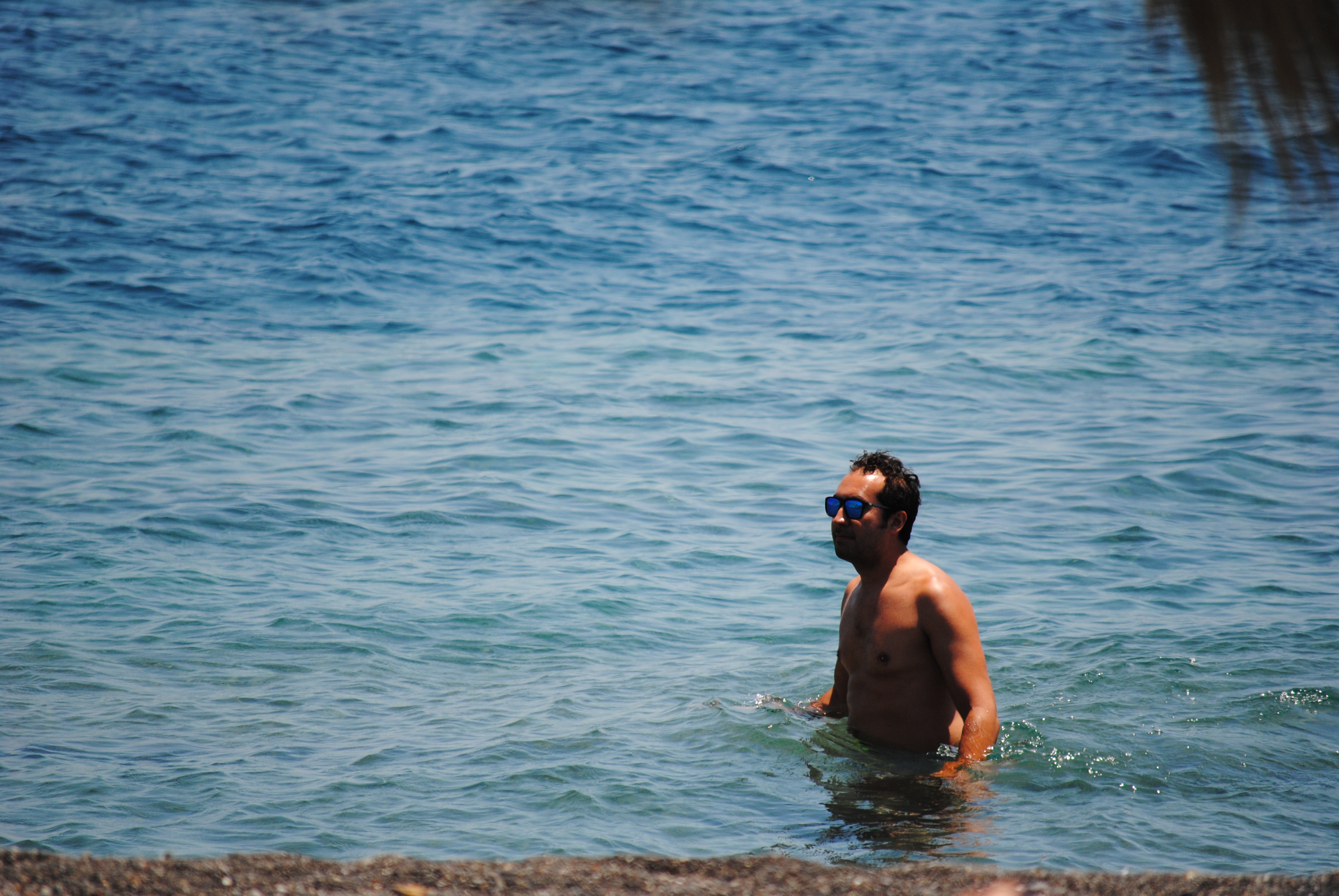 Soaking in the water at Perissa Beach, Santorini