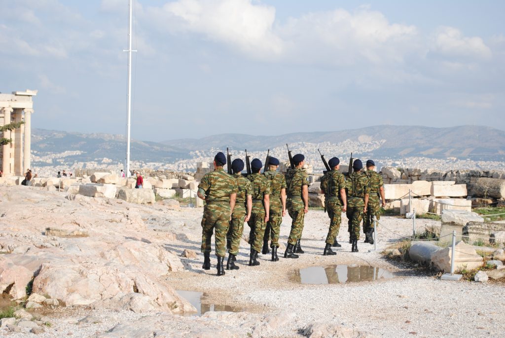 Arrive early to the Acropolis to see the guards raise the Greek flag at the site.