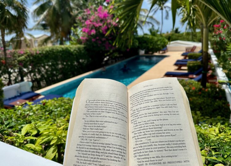 Reading a book at Weezie's Resort, Caye Caulker