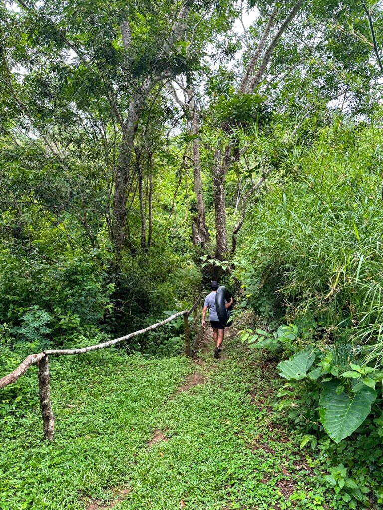 Walking along the tubing trail at Sweet Songs Jungle Lodge