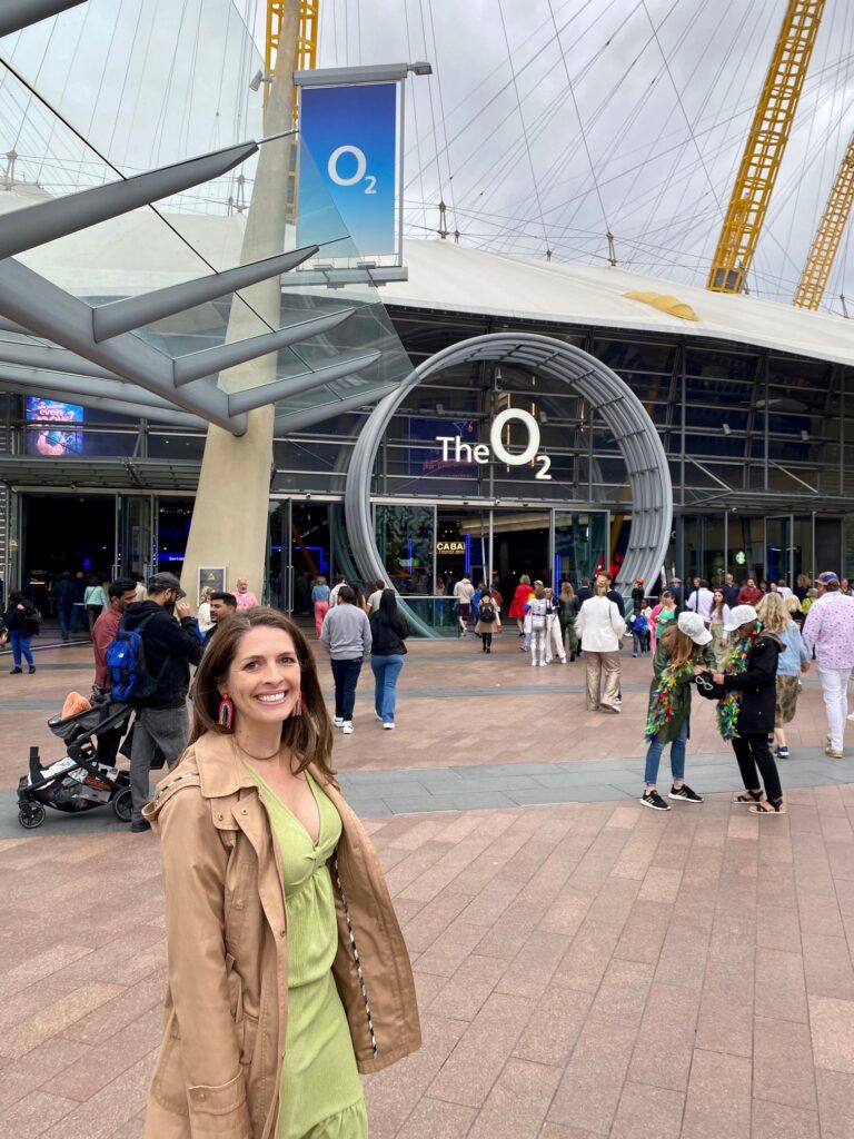 Kristy standing outside the O2 Arena in Greenwich