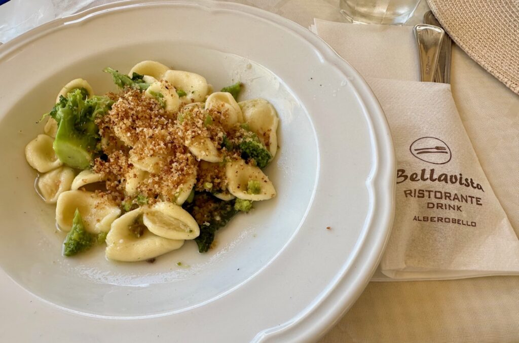 Plate of orecchiette with turnip tops at a restaurant in Alberobello, Italy
